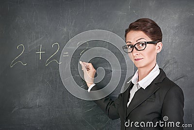 Woman teacher teaching maths Stock Photo