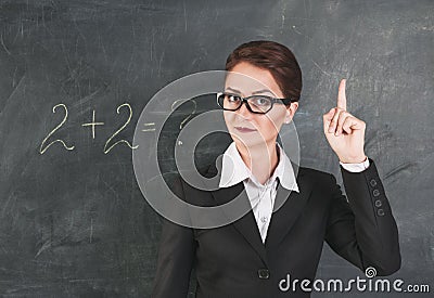 Woman teacher teaching maths Stock Photo