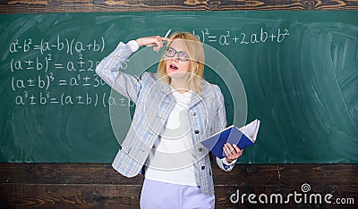 Woman teaching near chalkboard. Effective teaching involve acquiring relevant knowledge about students. What make great Stock Photo