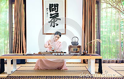 A woman with a teapot-China tea ceremony Stock Photo