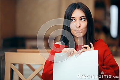 Woman Tearing Up Documents in a Restaurant Stock Photo