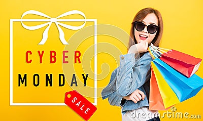 Woman teen smiling standing with sunglasses excited holding shopping bags multi color Stock Photo