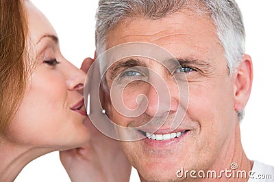 Woman telling secret to her partner Stock Photo