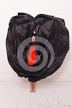 Woman tempting vampire demon. Girl covered with cloak. Devil concept. Halloween masquerade. Halloween party. Damn pretty Stock Photo