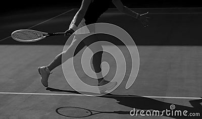 Woman tennis player in action. Black and white Stock Photo