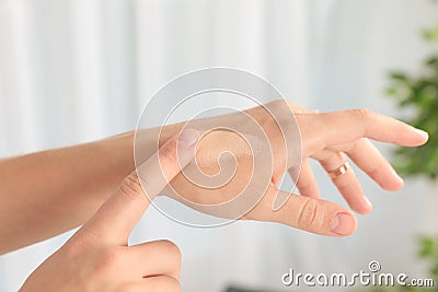 Woman testing foundation tone on hand Stock Photo