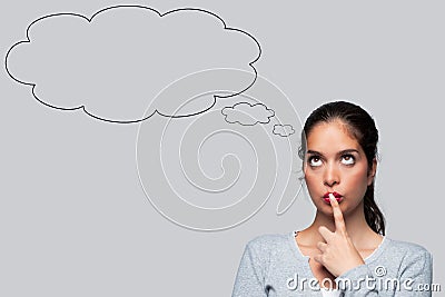 Woman thinking with blank thought bubbles Stock Photo