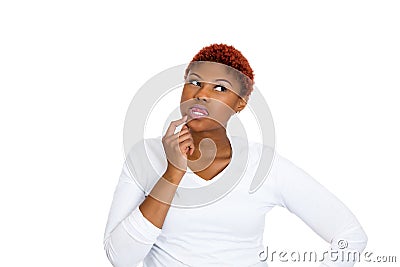 Woman thinking daydreaming something, plotting revenge Stock Photo