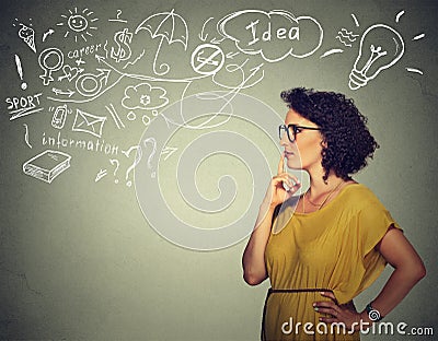 Woman thinking dreaming has many ideas looking side way Stock Photo