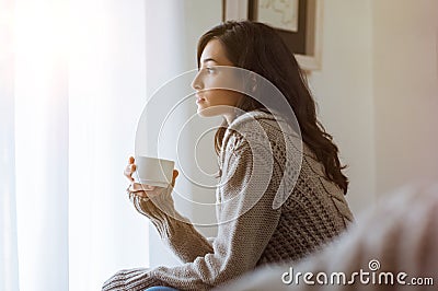 Woman thinking at home Stock Photo