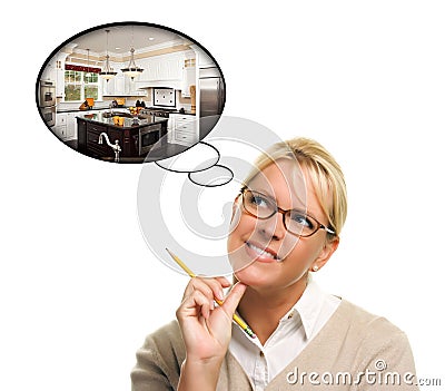 Woman with Thought Bubbles of a New Kitchen Design Stock Photo