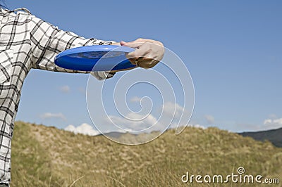 Woman throwing frisbee Stock Photo