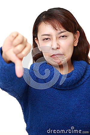 Woman with thumbs down gesture Stock Photo