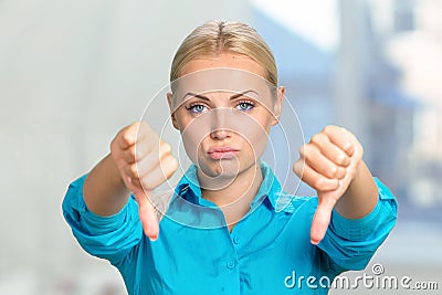 Woman with thumbs down Stock Photo
