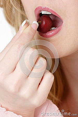 Woman about to eat a cherry Stock Photo