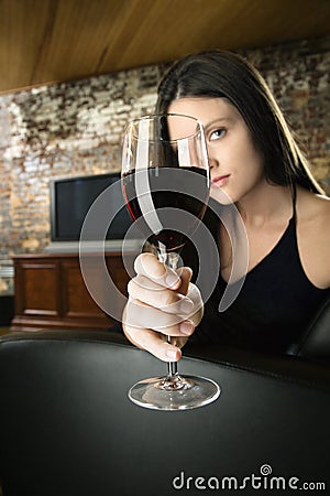 Woman toasting wine glass Stock Photo