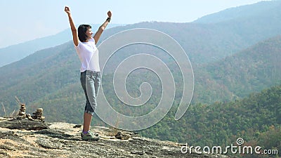 Woman on the top of the mountain_4K_1 stock footage Woman on the top of the mountain_4K_1 stock footage