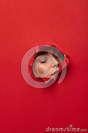 Woman in torn hole Stock Photo