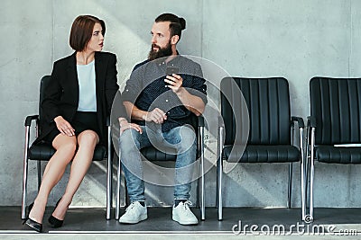 Woman touch man knee work harassment seduction Stock Photo