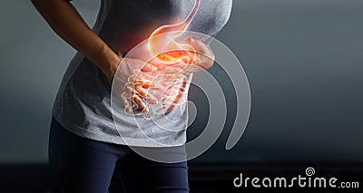 Woman touching stomach painful from stomachach. Stock Photo