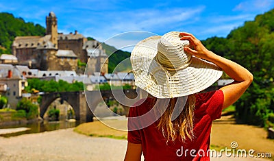 Woman tourist in France, beautiful village in Aveyron Stock Photo