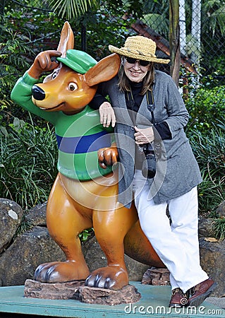 Woman tourist posing with kangaroo statue Gold Coast, Australia Editorial Stock Photo