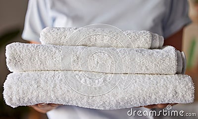 Woman, towels or laundry cleaning for hotel housekeeping maid, home cleaner service or relax resort worker. Zoom Stock Photo