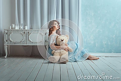 Woman with a toy bear. Stock Photo