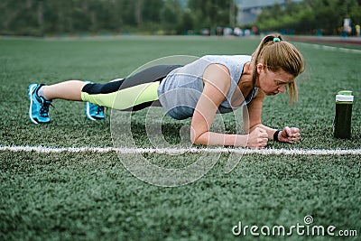 Woman training at the stadium. Physical activity and endurance. Stock Photo