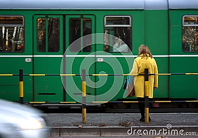 Woman at a tram stop Editorial Stock Photo