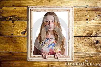 Woman trapped in frame. Stock Photo