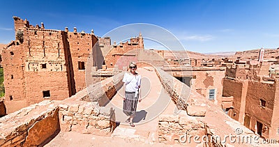 Woman on travel at Ait Benhaddou kasbah, Ouarzazate, Morocco. Stock Photo