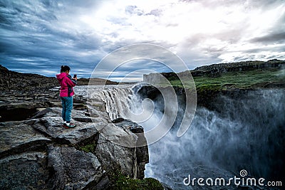 Traveler Travels to Dettifoss Waterfall in Iceland Editorial Stock Photo