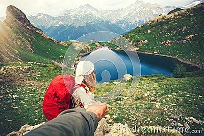 Woman Traveler with backpack holding Man hand following Travel hiking Stock Photo