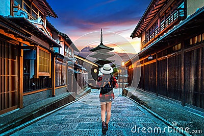 Woman traveler with backpack walking at Yasaka Pagoda and Sannen Zaka Street in Kyoto, Japan. Stock Photo