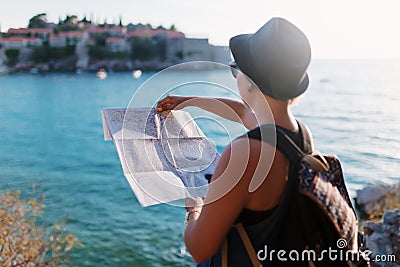 Woman traveler with map near Adriatic Sea Stock Photo
