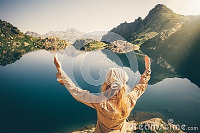 Woman Traveler meditating harmony with nature Stock Photo