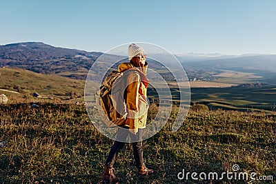 woman traveler mountain top nature travel adventure sunny day Stock Photo