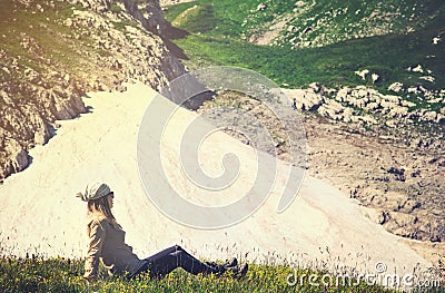 Woman Traveler relaxing on grass valley Travel Lifestyle concept Summer journey Stock Photo