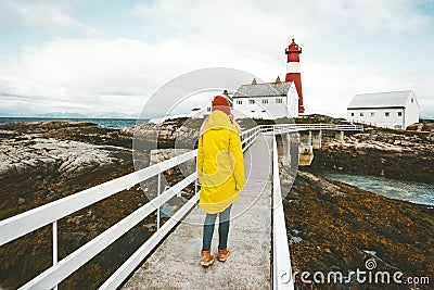 Woman Traveler sightseeing Norway lighthouse Stock Photo