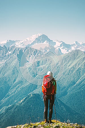 Woman Traveler standing at mountains Stock Photo