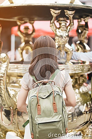 woman traveler visiting in Taiwan, Tourist with hat sightseeing in Longshan Temple, Chinese folk religious temple in Wanhua Stock Photo