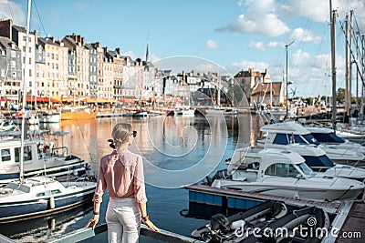 Woman traveling in Honfleur, France Stock Photo