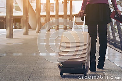 Woman traveller in airport walkway. Travel concept. Stock Photo