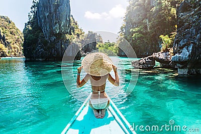 Woman travelling on the boat in Asia Stock Photo