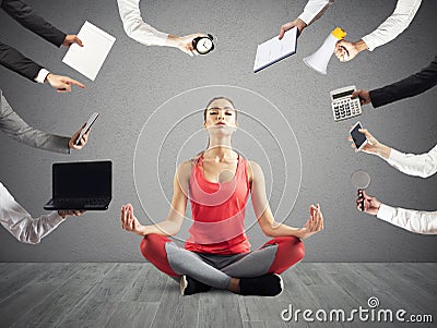 Woman tries to keep calm with yoga due to stress and overwork at wok Stock Photo