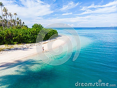 Woman on tropical beach at Tailana Banyak Islands Sumatra tropical archipelago Indonesia, Aceh, coral reef white sand beach travel Stock Photo