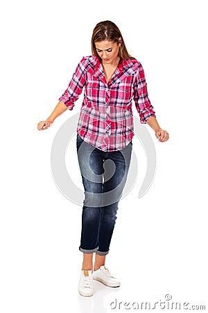 Woman trying to trample something Stock Photo