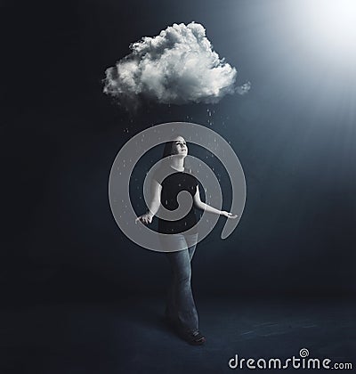 Woman under rain cloud Stock Photo