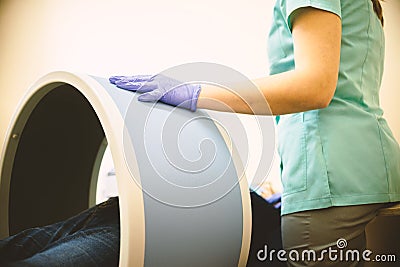 Woman undergoing BTL magnetotherapy in clinic Stock Photo